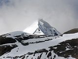 60 Mount Kailash South, East and North Faces From The Eastern Valley On Mount Kailash Outer Kora About 30 minutes from the end of the descent from the Dolma La, a valley comes down from the Khando Sanglam La to join the main trail. This valley provides the only glimpse of the Eastern or crystal Face of Mount Kailash. The Kailash South Face is to the left and the North Face is to the right.